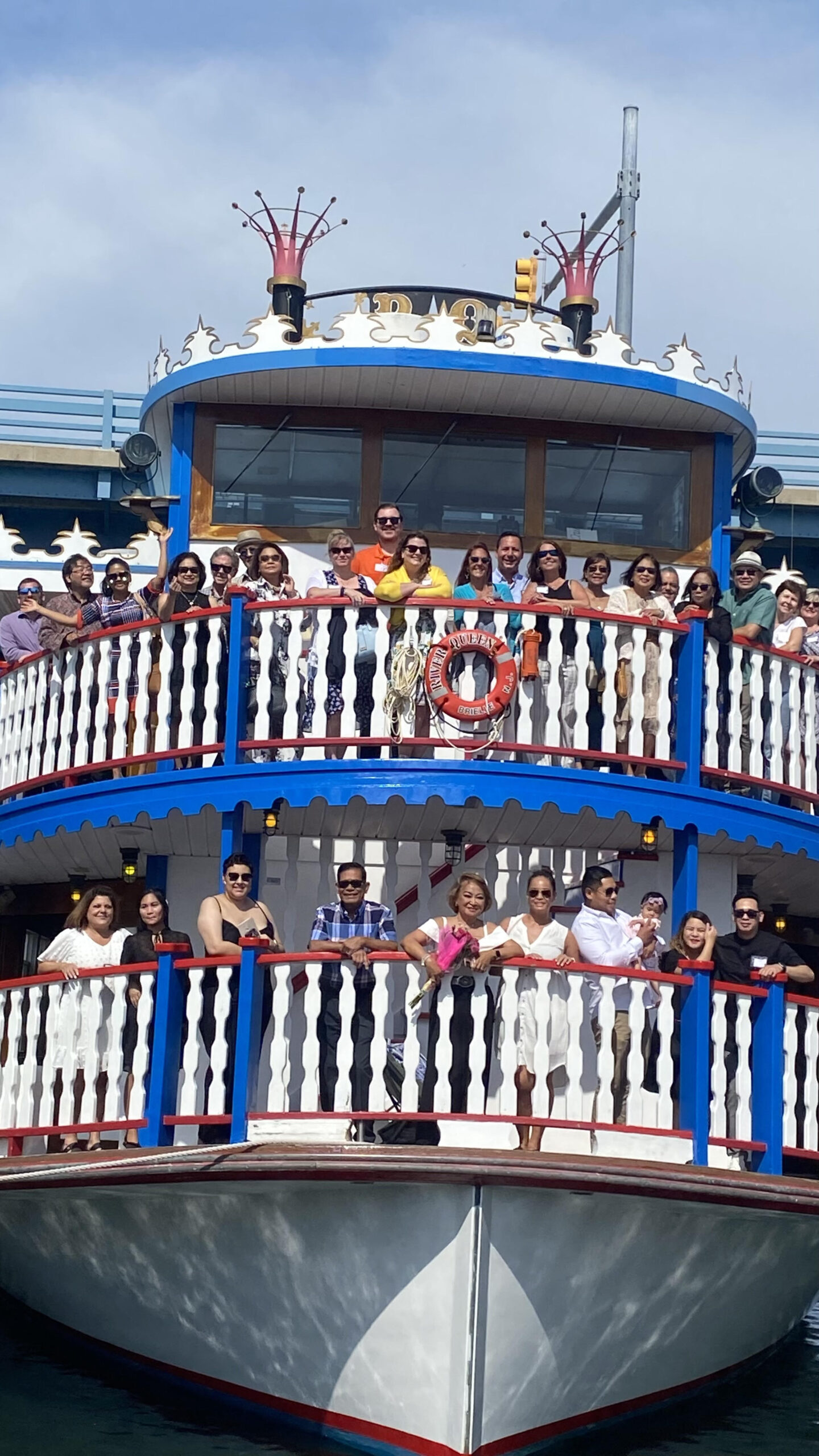 Photo of a boat with people celebrating Executive Home Care Freehold 10th Anniversary